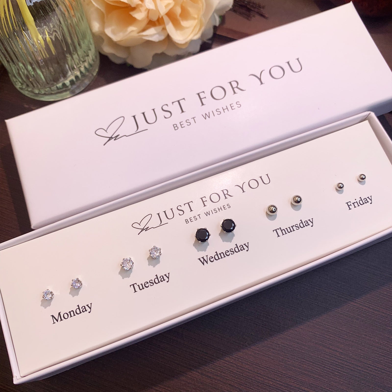 Playful heart cat ear studs elegantly displayed