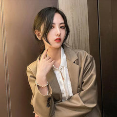 Handcrafted irregular design pearl bracelet on model