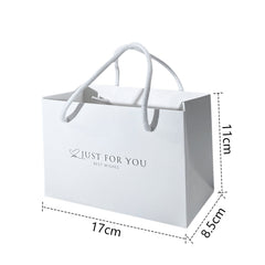 Elegant gift presentation with ribbons and tags