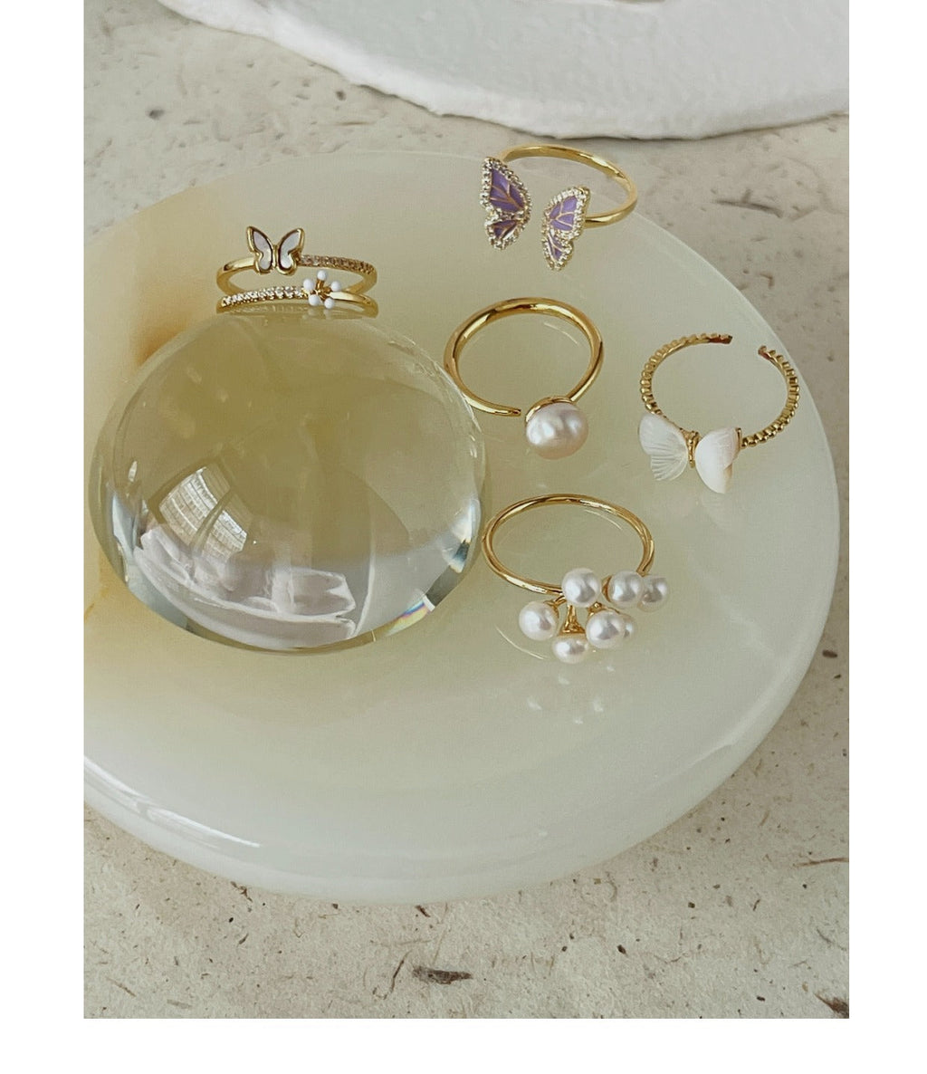 Elegant butterfly ring on mannequin hand
