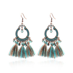 close-up of tassel earrings highlighting details