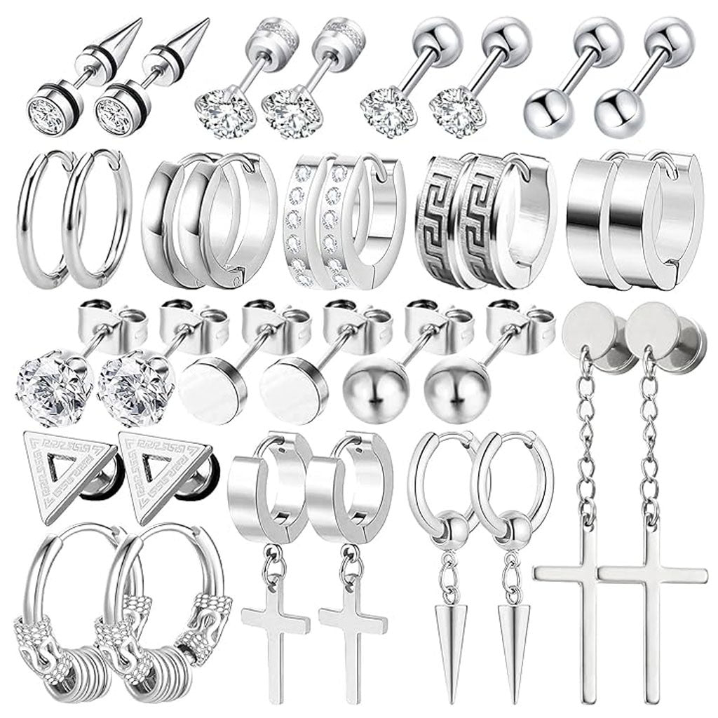 Black hoop and stud earrings laid out beautifully