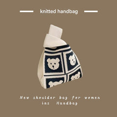Women using a knitted tote bag outdoors