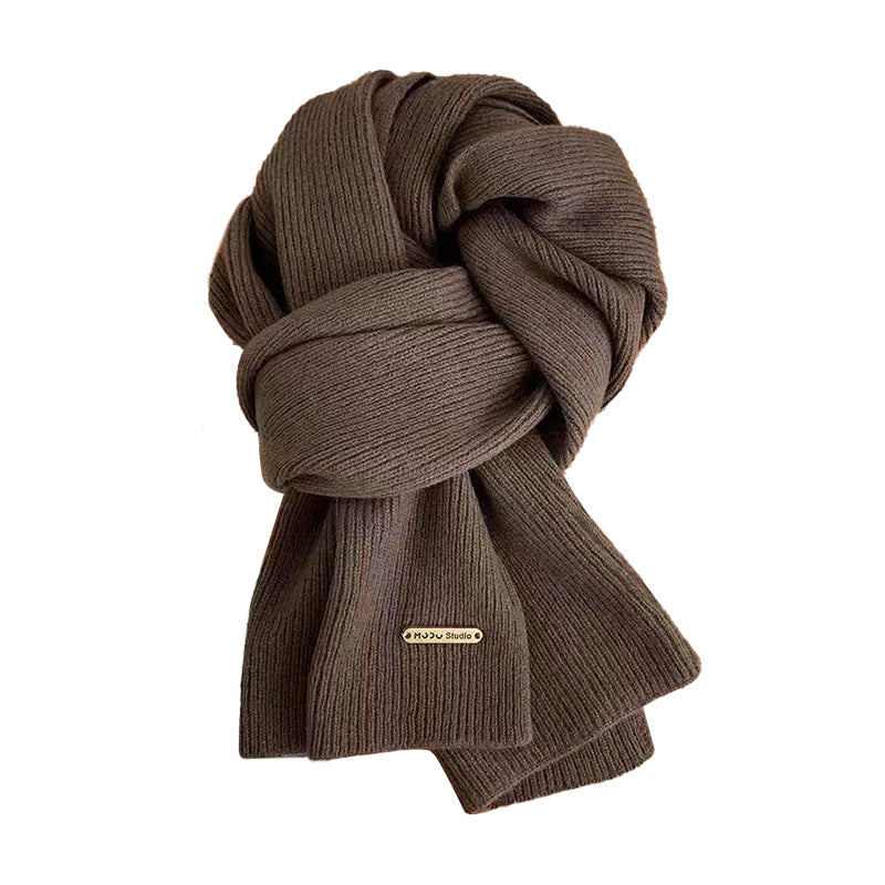 Cozy knitted scarf in black for winter gatherings