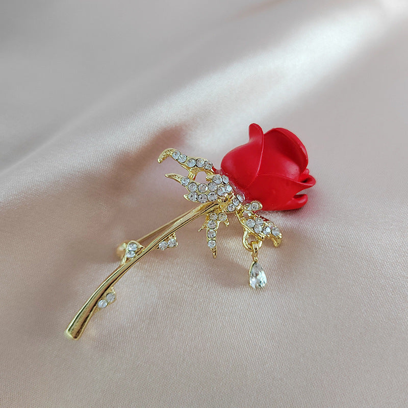 Close-up of rhinestone tulip and rose brooch