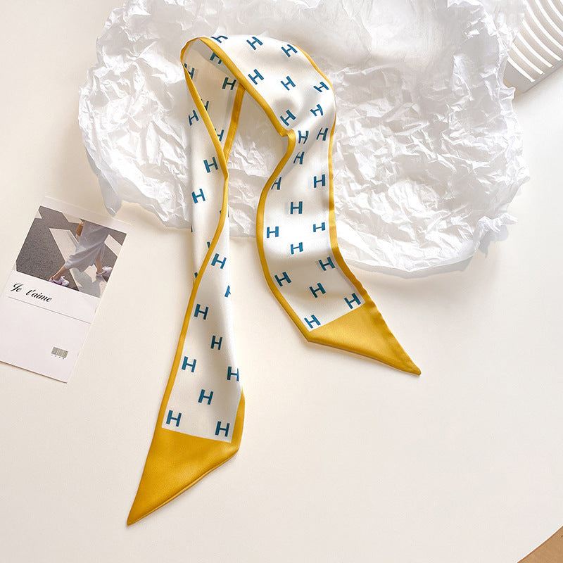 yellow scarf styled as a hairband