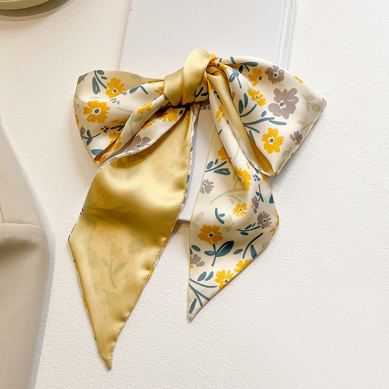 yellow scarf displaying floral designs