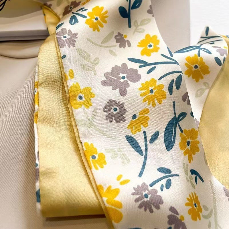 detailed view of floral scarf design