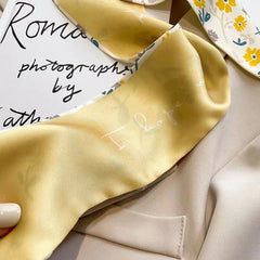 yellow floral scarf draped elegantly