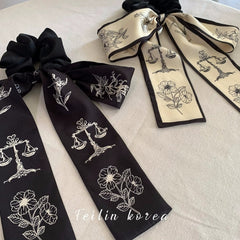 Close-up of stylish hair tie with bow detail