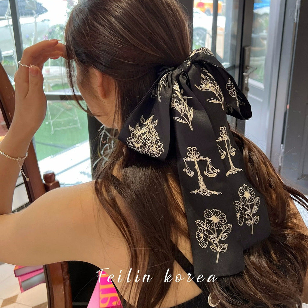 Close-up of stylish hair tie with bow detail