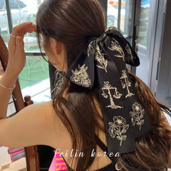 Close-up of stylish hair tie with bow detail