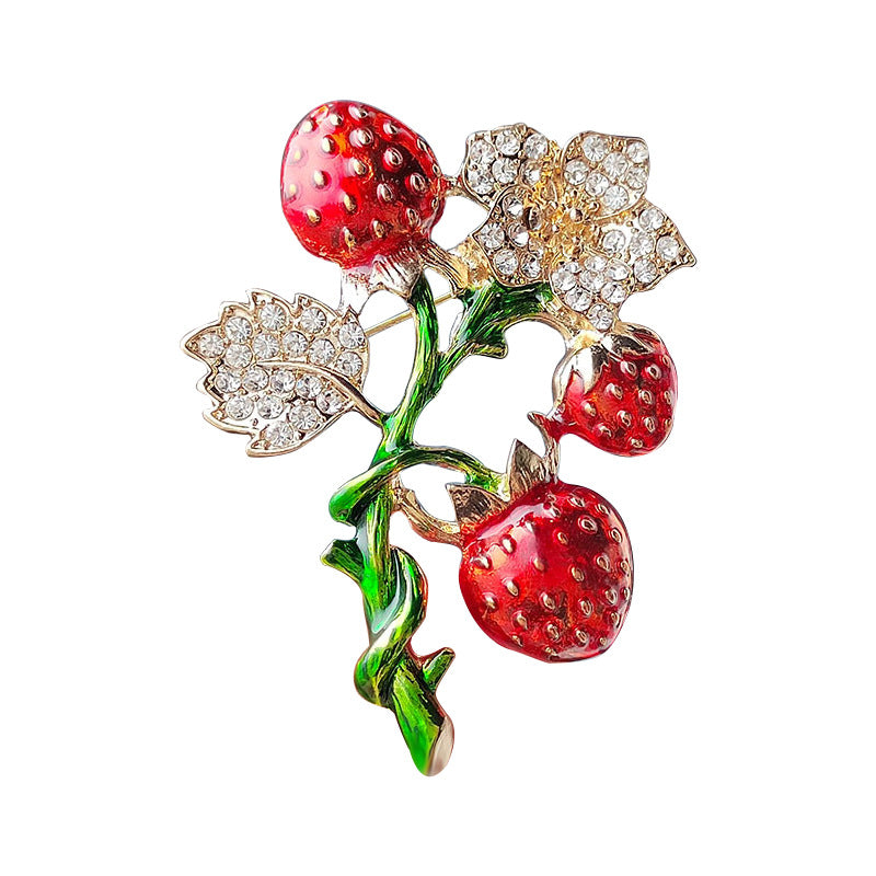Enamel Strawberry Brooch Displayed on a Light Background