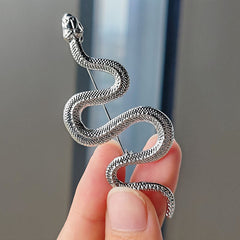 Close-up of silver snake brooch