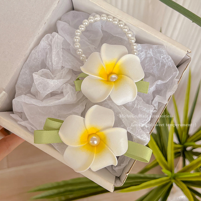 Elegant floral egg hair clip set styled on model